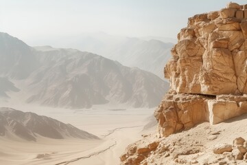 Desert landscape with rocky cliffs and distant mountains.