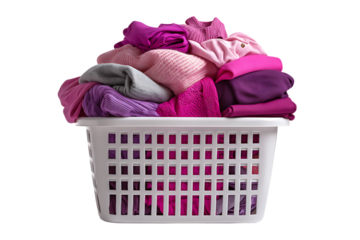 Laundry basket overflowing with pink and purple clothes.