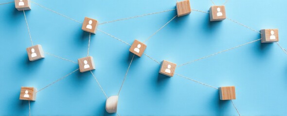 a network connecting people on a blue background, with wooden blocks representing human connections and social network concepts
