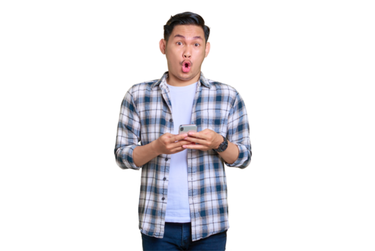 Amazed young Asian man in plaid shirt using mobile phone and looking at camera isolated on transparent background - Powered by Adobe