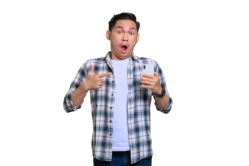 Shocked young Asian man in plaid shirt pointing fingers at a mobile phone, receiving amazing news isolated on transparent background