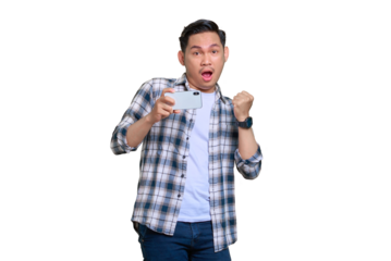 Excited young Asian man in plaid shirt celebrating success with a mobile phone, raising hands rejoiced big luck isolated on transparent background
