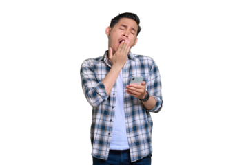 Bored young Asian man in plaid shirt holding mobile phone and feeling lack of sleep isolated on transparent background