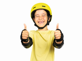 Child wearing skate yellow helmet approving doing positive gesture with hand, thumbs up smiling and...