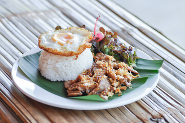 stir fried pork with garlic , pork and rice or deep fried pork or fried pork with rice and sunny side up egg or fried egg