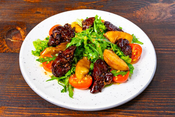 Fresh salad with greens, tomatoes, and flavorful toppings