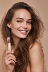 An attractive woman with gorgeous hair smiles while holding a foundation bottle.