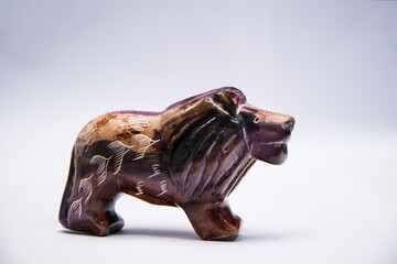 Hand-carved Kenyan stone Lion figurine with painted detail. Ideal for themes of African culture,...