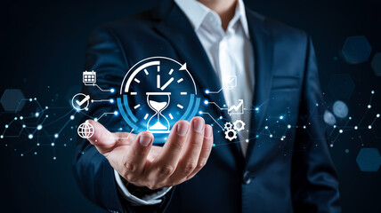 A professional business concept image featuring a hand in a dark navy suit holding a glowing blue holographic interface displaying a clock and hourglass icon.