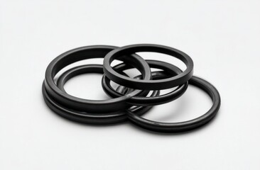 Naklejka premium Interlocking Rubber Rings, A Close-Up View of Circular Shapes, Industrial Design Elements, and Abstract Forms in Black.