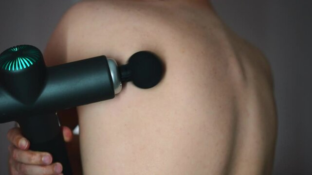 Muscle pain in the body.
A man massages his body with a massager.
Anti-cellulite massage.
Health of the body and skin.
Clogged muscles in the body.
Treatment of the spine and hernia