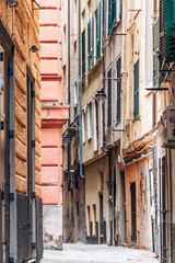 Genoa, Italy - September 22, 2024: Narrow alleys in the historic center of Genoa, showcasing the charm of the old town with its winding streets and traditional architecture