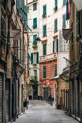 Genoa, Italy - September 22, 2024: Narrow alleys in the historic center of Genoa, showcasing the charm of the old town with its winding streets and traditional architecture