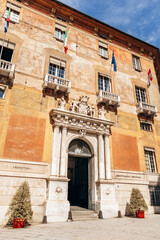 Genoa, Italy - September 22, 2024: Majestic marble portal with sculpted figures and city crest marks the entrance to Palazzo Doria-Tursi, Genoa’s city hall and UNESCO World Heritage site on Via Gariba