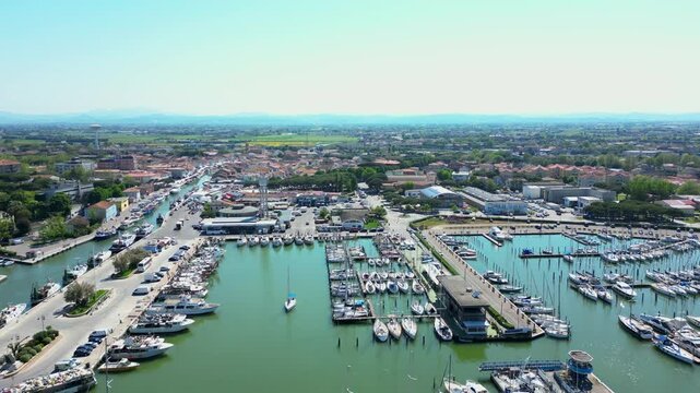 Italy, 01 May 2025: Aerial view of Cesenatico with its port and its canal with historic boats. The town is quiet and peaceful but also very touristic with many typical restaurants of Romagna