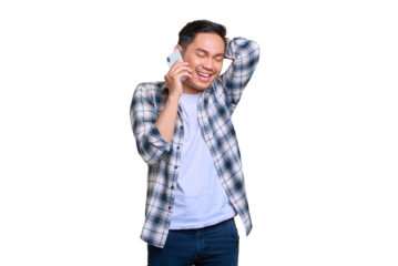 Cheerful young Asian man in plaid shirt talking on mobile phone isolated on transparent background