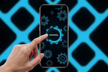Smartphone screen displaying "updating" message during software update with gears background elements and hand touch.