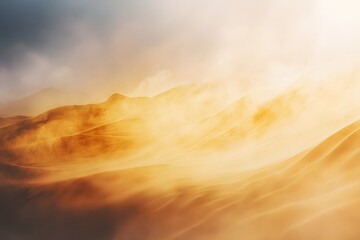 Mountain range with a hazy, yellowish sky. The mountains are covered in a light dusting of snow