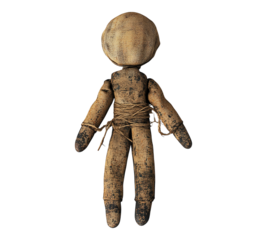 A creepy looking doll with a rope around its waist
