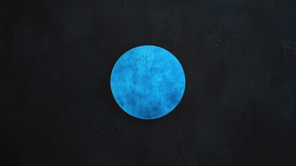 A  glowing,  vibrant  blue  sphere  against  a  dark  background.