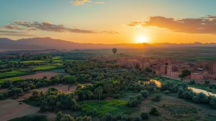 On April 23, 2025, hot air balloons will fly over the desert near Marrakech, Morocco as the sun rises. It's a calm and free adventure with beautiful views.
