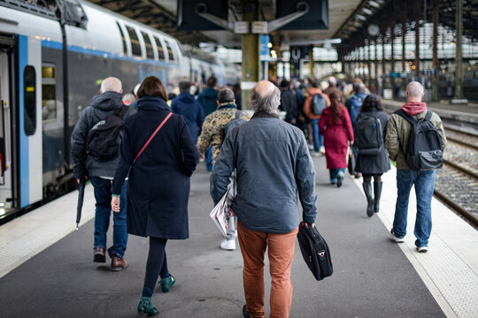 view of travelers going to work in the morning at the train station