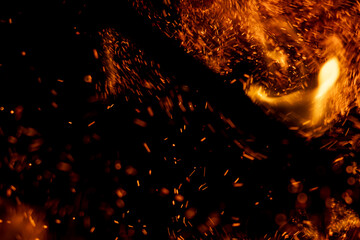 A black background with a lot of fire and smoke