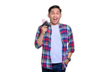 Fototapeta premium Shocked young Asian man in plaid shirt showing wallet with cash money isolated on transparent background