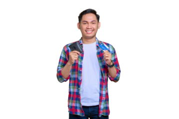 Smiling young Asian man in plaid shirt holding wallet and showing credit card isolated on transparent background
