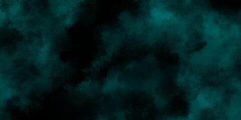 Dark blue background with clouds. Teal color powder explosion on black background. Smoke isolated on dark background.