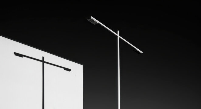 Modern Minimalist Wall Sconce Lighting Fixture in Dark Interior Setting with Warm Glow
