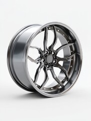 Obraz premium High-quality chrome alloy wheel showcasing intricate design against a neutral backdrop