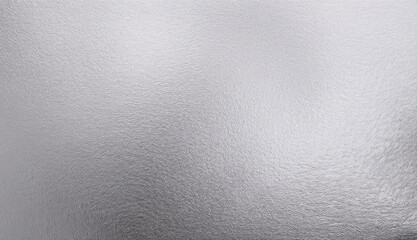 Close-up of a shiny silver foil texture with reflective properties and metallic sheen