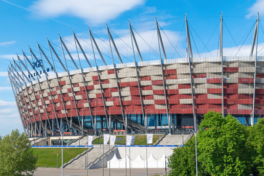Modern multi-colored stadium with architectural design under blue sky. National Stadium. The PGE Narodowy. Warsaw