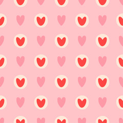 Repeating pattern of hearts on a pink background. There are two types of hearts: solid pink hearts and red hearts inside off-white circles.
