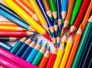 Fototapeta premium Vibrant collection of multicolored sharpened pencils arranged in a circular pattern, close-up of artistic stationery 