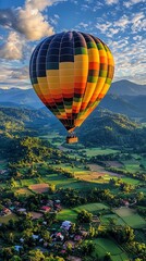 Fototapeta premium Colorful Hot Air Balloon Over Scenic Landscape