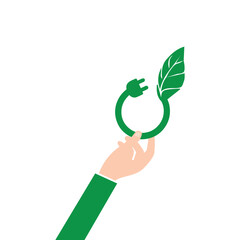 Hand holding a green energy electrical plug with leaf