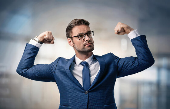 Confident businessman flexing arms muscles imagine super power. Fit business person in a confident and strong pose