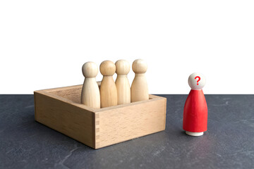 A minimalistic scene with five wooden figurines. Four natural wood-colored figurines stand in a row inside a dashed rectangular box