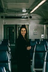 The girl is riding the train