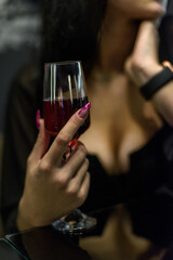 Girl in cafe, glass in sharp focus, blurred background. Fleeting moment.