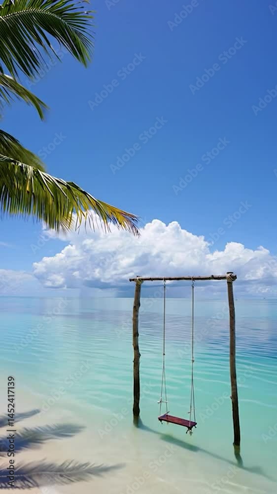 Poster a serene beach scene featuring a wooden swing suspended from a robust frame, positioned on pristine 