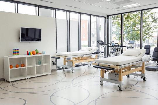 two modern examination tables in a bright and serene medical facility