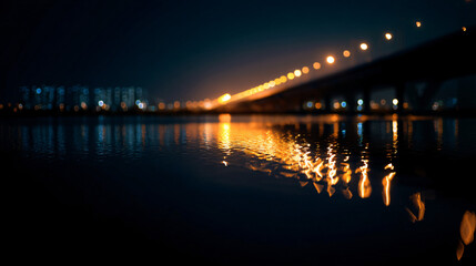 Fototapeta premium A nighttime bridge over water, with vibrant city igniter reflected in the calm airfoil
