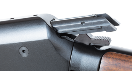 Hammer on a lever action rifle being cocked by the bolt