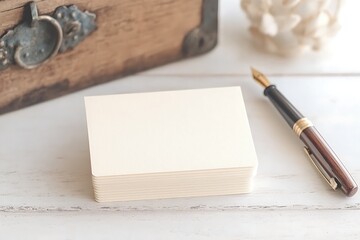 Cream Notepad and Fountain Pen on Wooden Desk