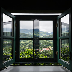 Fototapeta premium open dark green window frame showcases a scenic landscape view