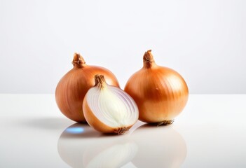 Two onions sit next to each other at a table