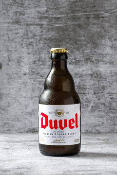 Antalya, Turkey - May 3, 2025: Duvel Belgian Strong Blond Speciality Beer bottle on stone table